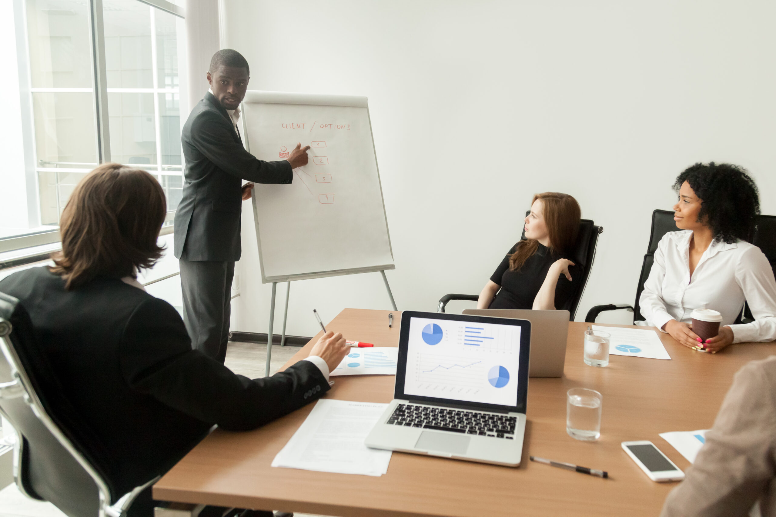African-american businessman giving presentation explaining new